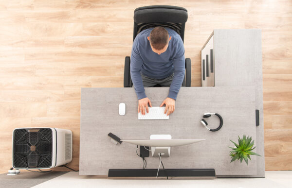 Home Office Worker in Front of Computer Top View